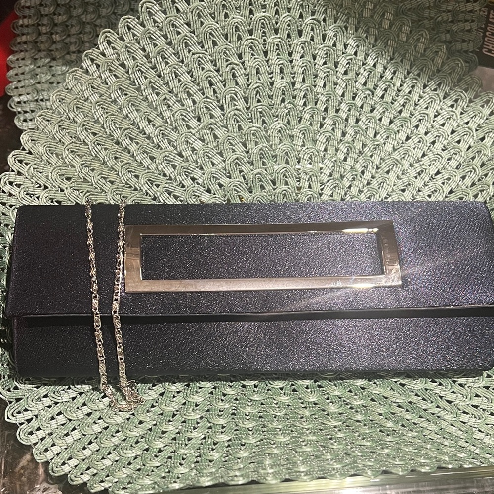 Elegant Blue clutch with Silver Accents. Can be worn with  silver chain